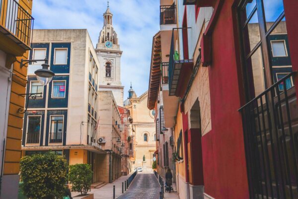 Carrer de la Corretgeria leading to Collegiate Basilica of Xàtiva, Valencia, Spain