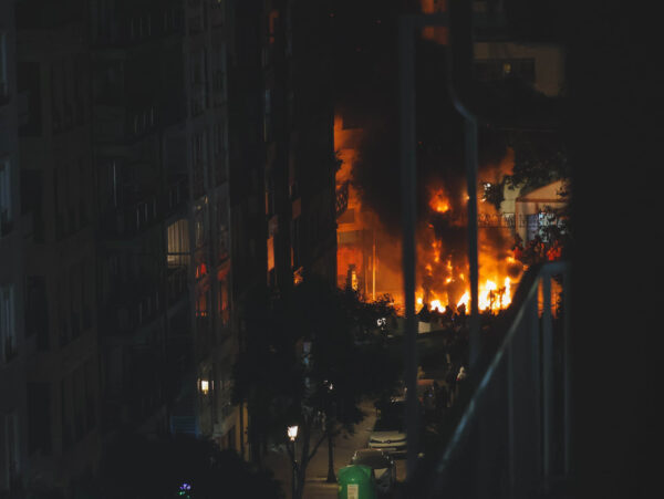 A Valencian street with a burning falla (2026).