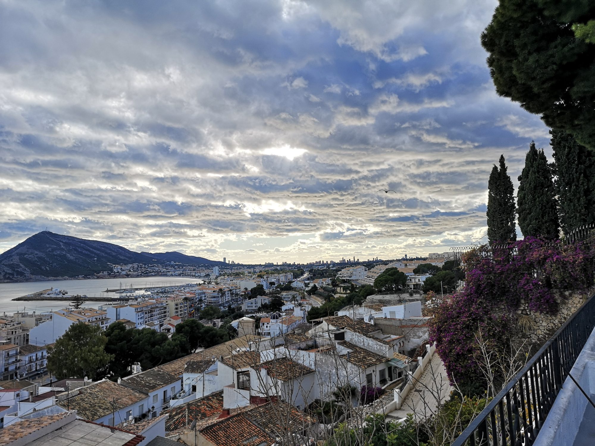 View over the rooftops of Altea Old Town (Casco Antiguo) to the bay and the Serra Gelada (Sierra Helada)