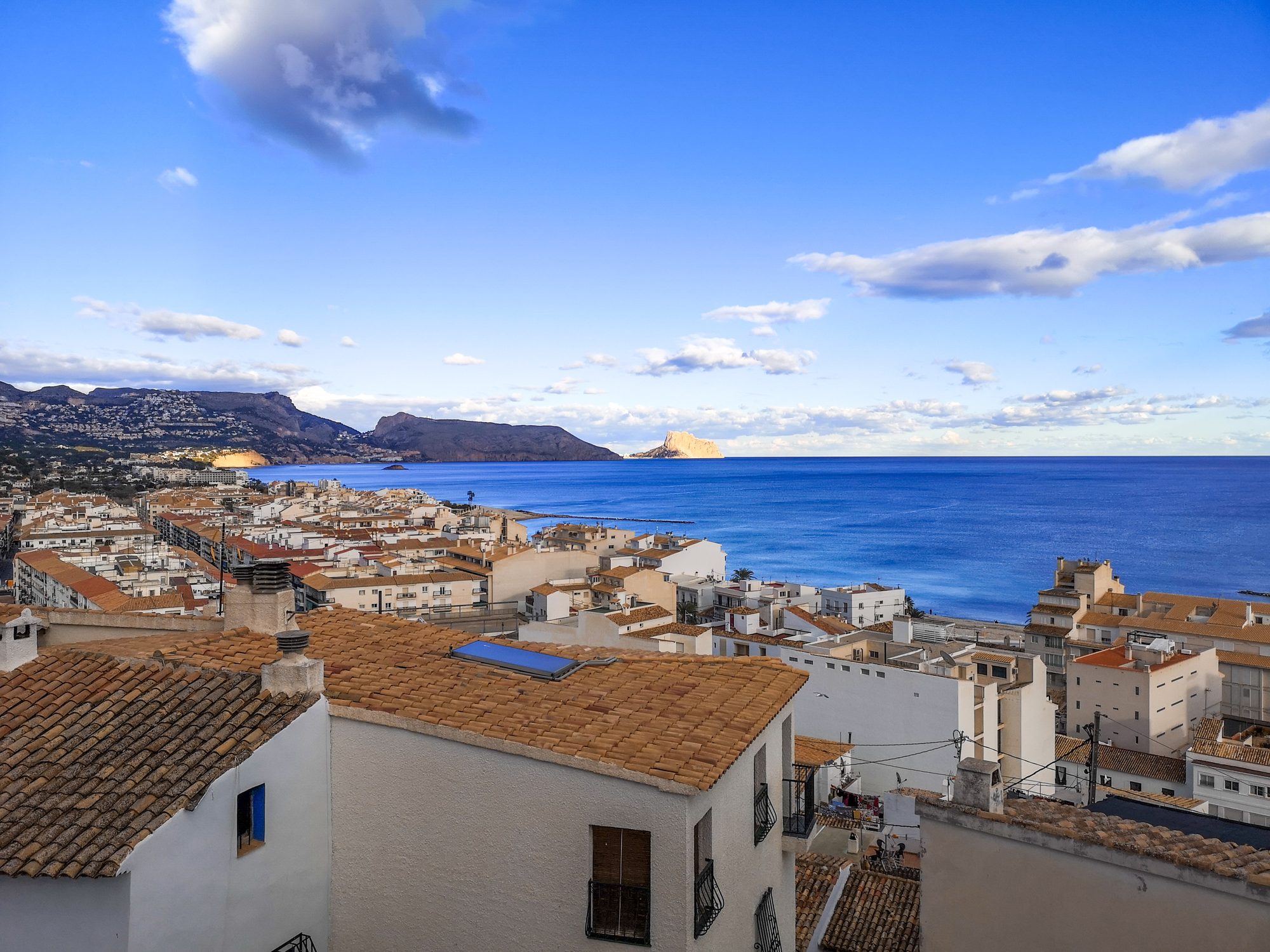 Rooftops of Altea Old Town (Casco Antiguo) running down to the blue bay and headland