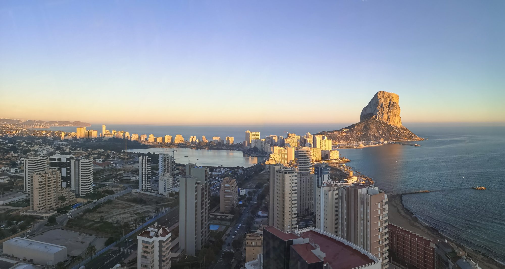 Peñón de Ifach at sunset above Calpe and its salt lake